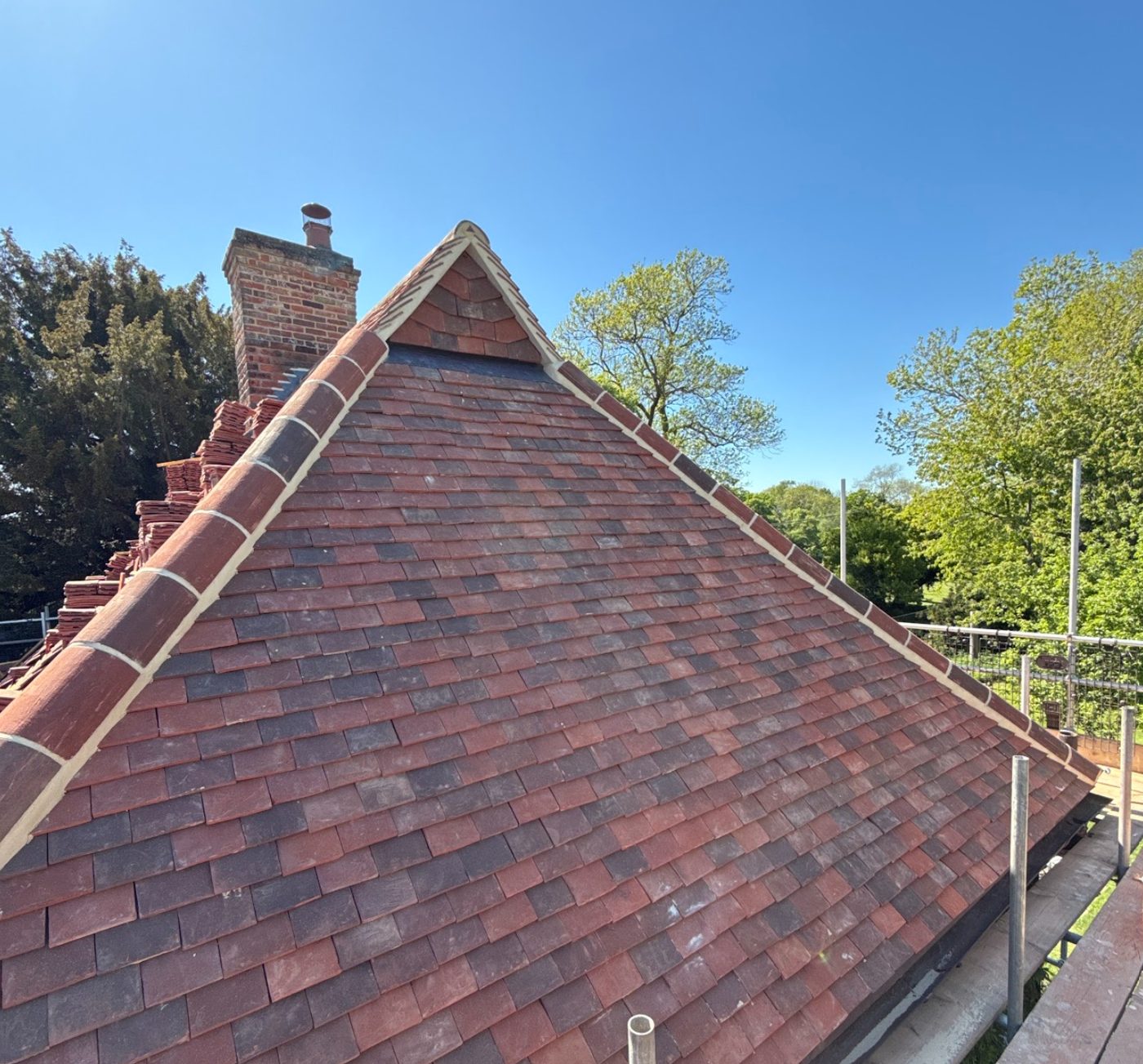 Completed tiled roof with decorative ridge tiles