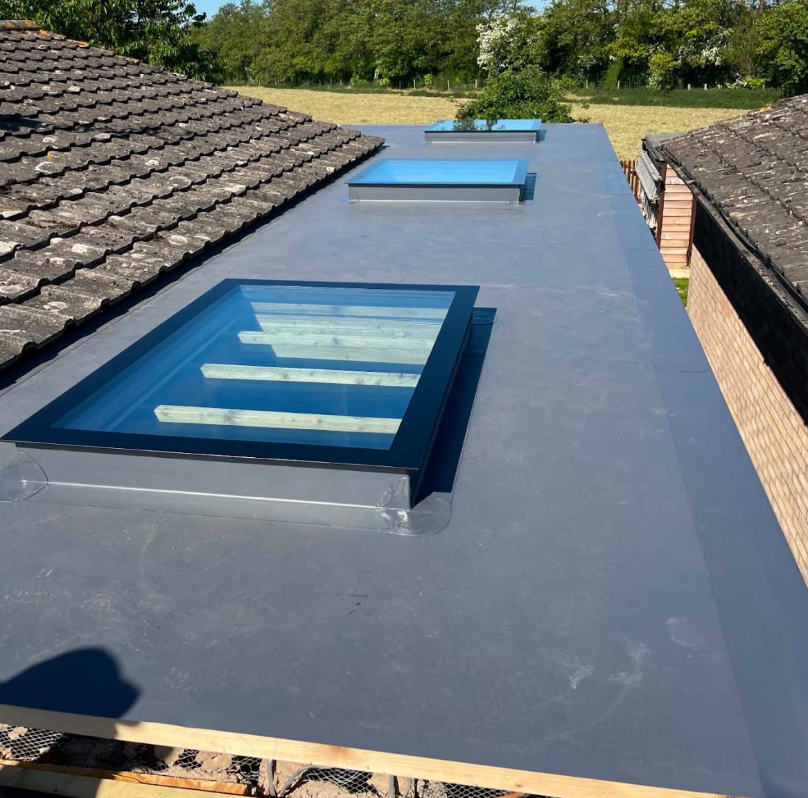Completed flat roof membrane with rooflights